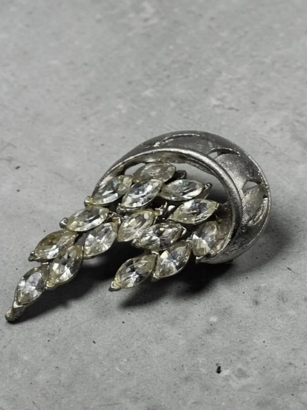 None this brooch